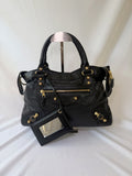 Balancing The Town Bag with Giant Gold Hardware in Black