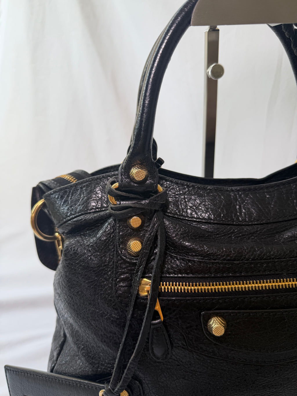 Balancing The Town Bag with Giant Gold Hardware in Black